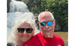 Mary and Paul in front of roaring Shequaga Falls